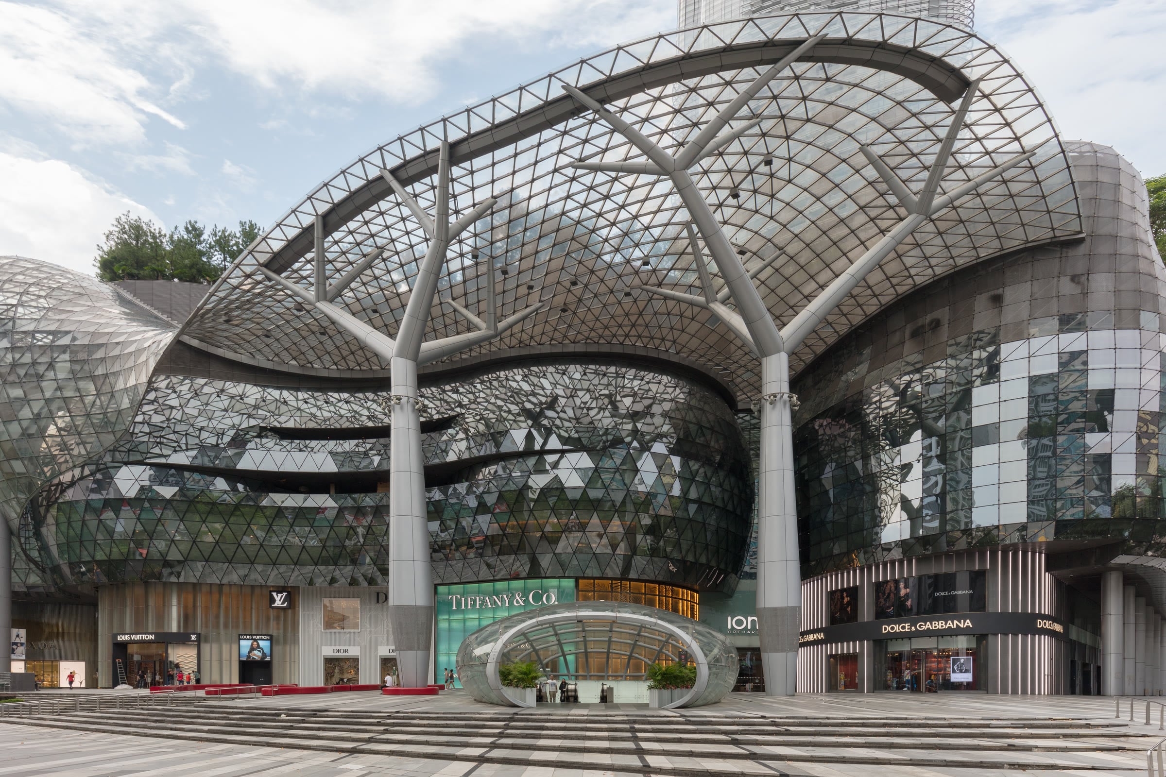 The glass and steel canopy of ION Orchard above its luxury shopfronts on Orchard Road.